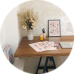 desk with flowers and papers